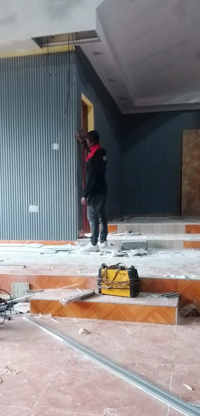 Jose Interior and Decor crew mixing plaster on a Nairobi site during a renovation