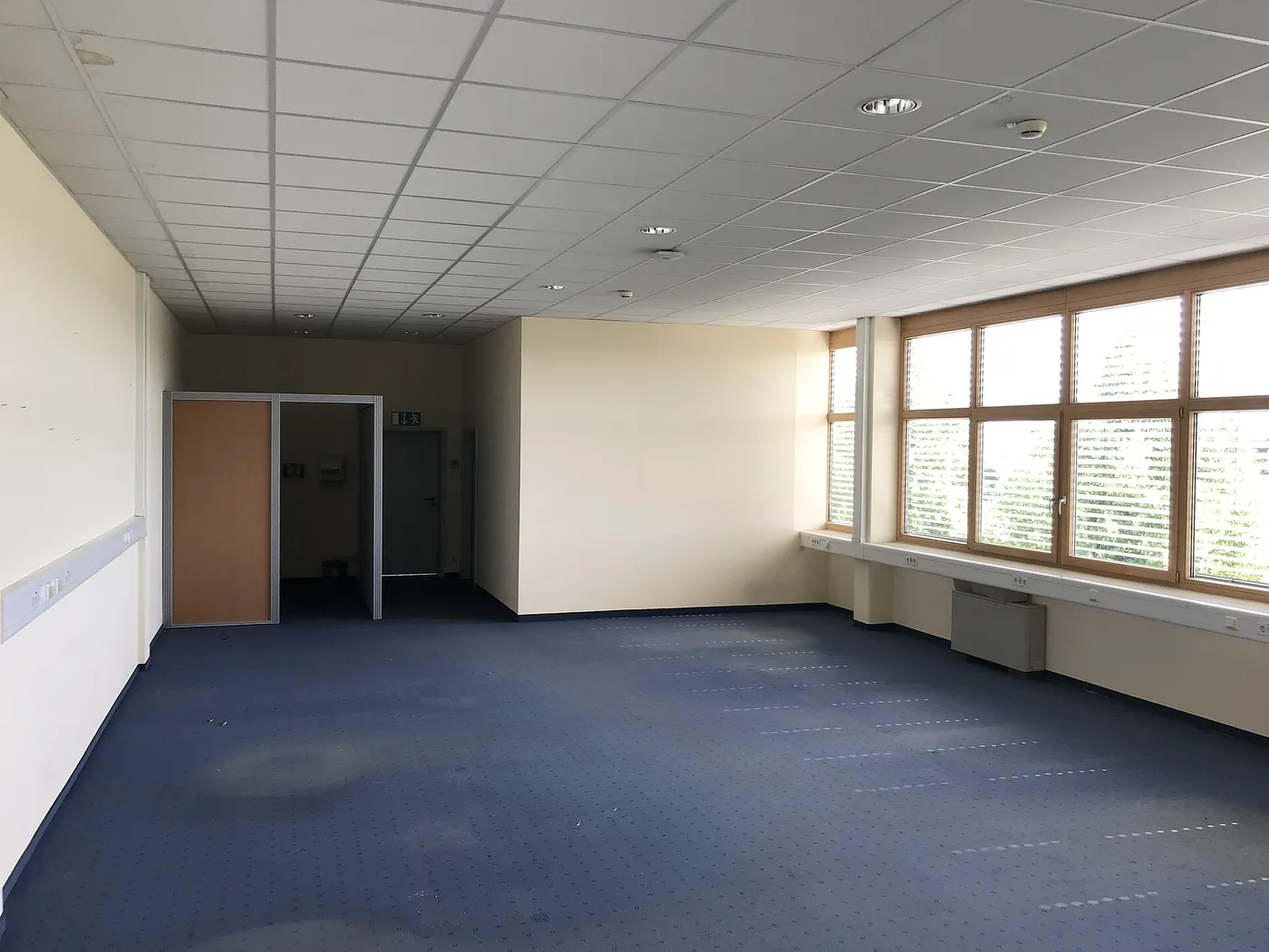 Before: empty office floor plate with ceiling grid, Westlands