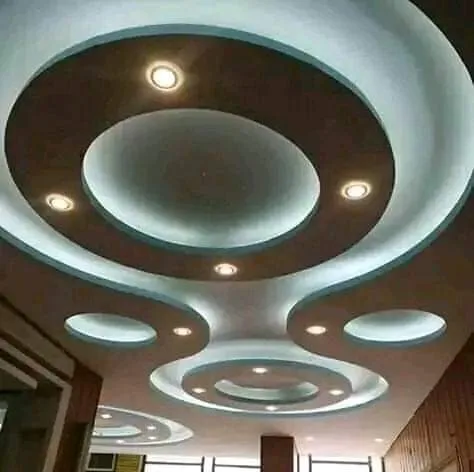 Layered gypsum ceiling with cove lighting over a dining space, Nairobi